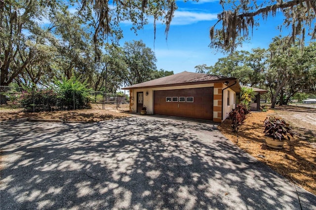 view of side of property with a garage