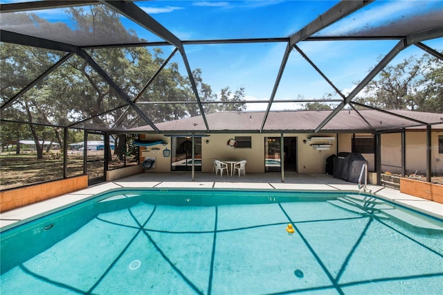 view of pool featuring area for grilling, a lanai, and a patio