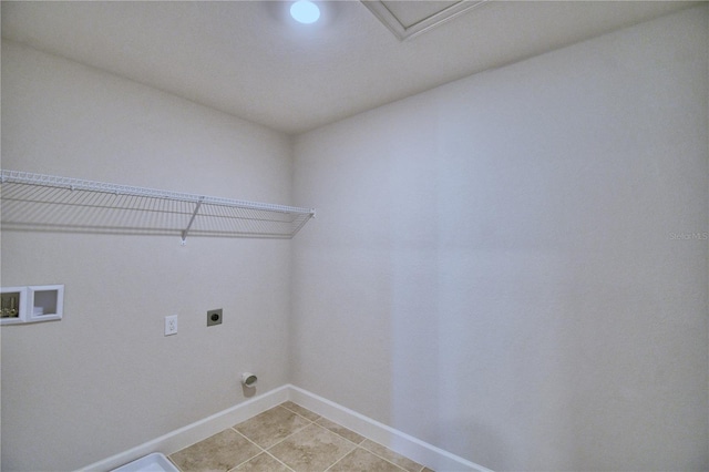 laundry area featuring hookup for a washing machine, light tile patterned flooring, and hookup for an electric dryer