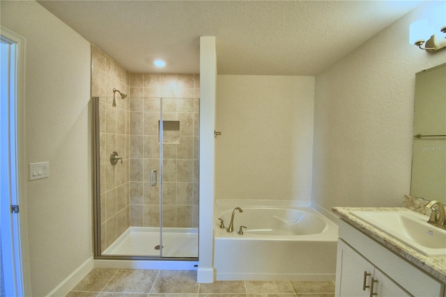 bathroom featuring tile patterned floors, vanity, and independent shower and bath