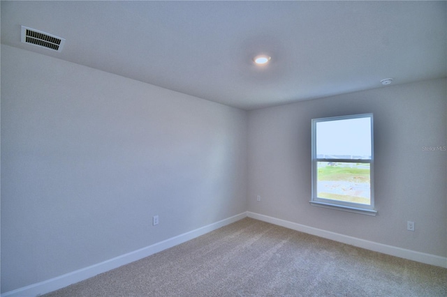 spare room featuring carpet flooring