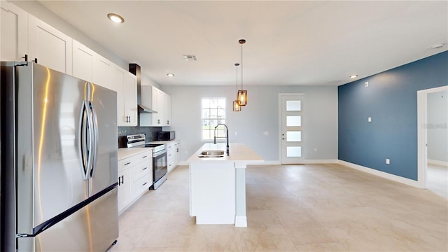 kitchen featuring sink, white cabinets, a center island with sink, and appliances with stainless steel finishes