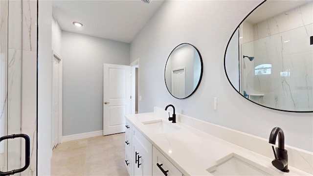 bathroom featuring vanity and an enclosed shower