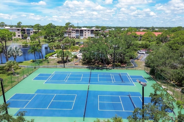 view of sport court with a water view