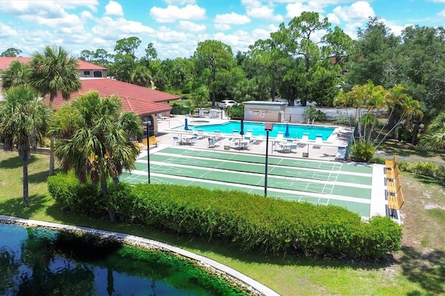 view of pool with a water view