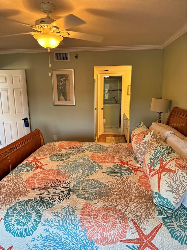 bedroom featuring ensuite bathroom, crown molding, and ceiling fan