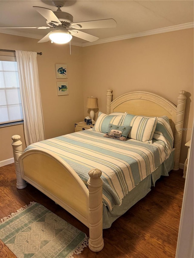 bedroom with ceiling fan, dark hardwood / wood-style floors, and ornamental molding