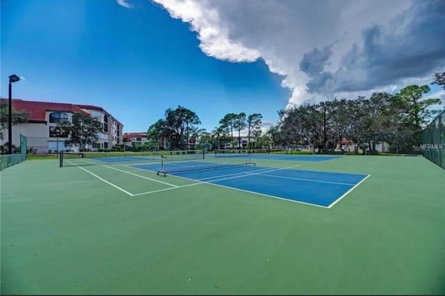 view of sport court with basketball hoop