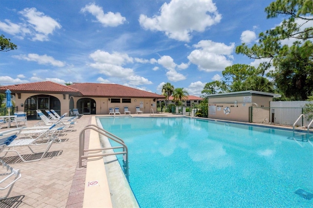 view of swimming pool with a patio area