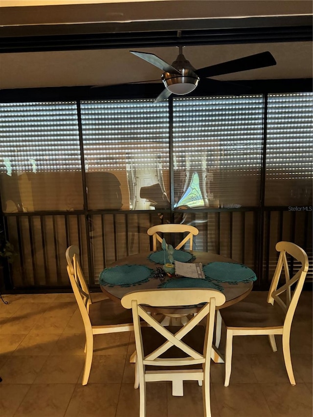 sunroom featuring ceiling fan