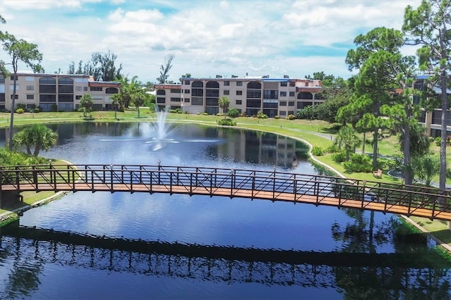 surrounding community with a water view