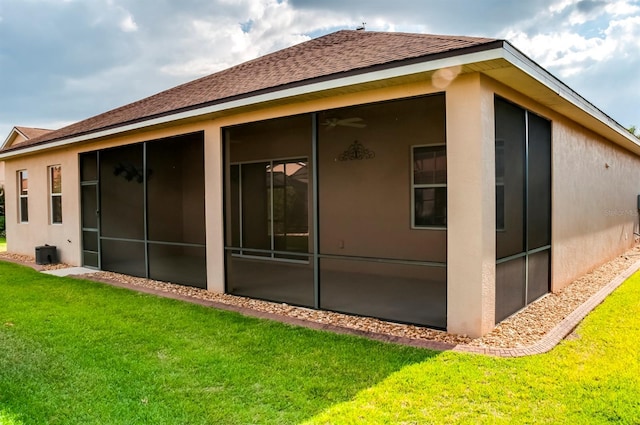 view of side of property with a lawn