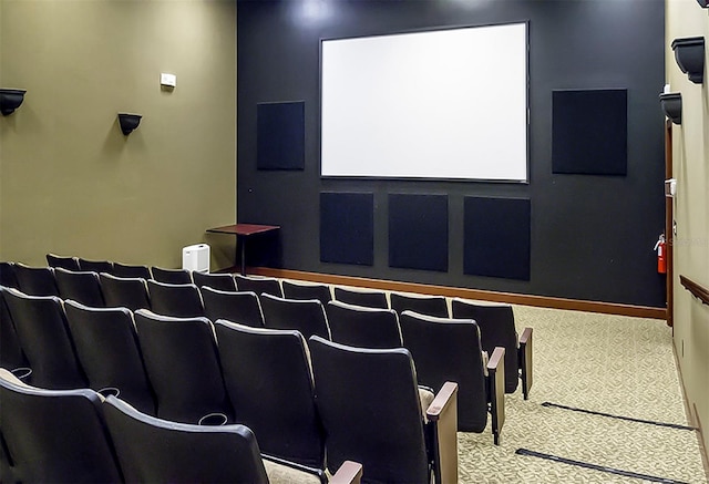 home theater with baseboards and carpet flooring
