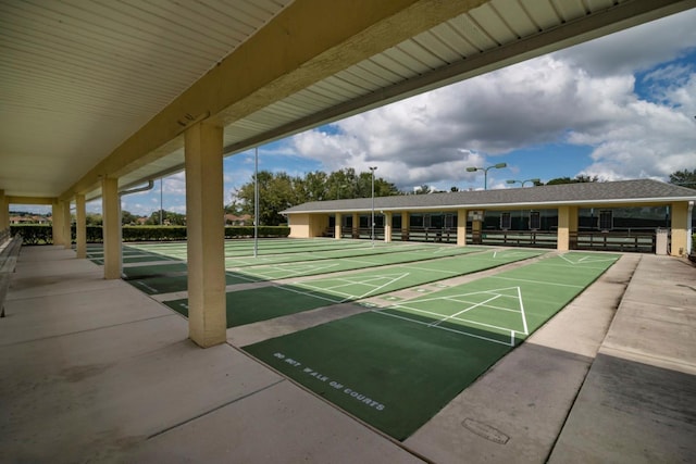 view of home's community featuring shuffleboard