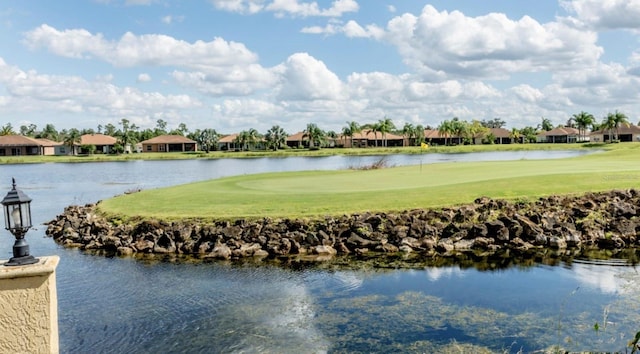 water view with a residential view and golf course view