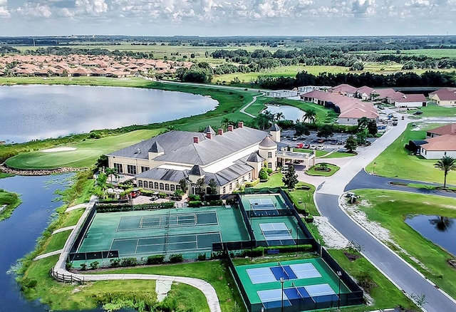 drone / aerial view featuring a water view and a residential view