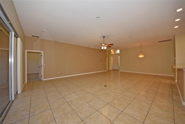 empty room featuring ceiling fan and light tile patterned flooring