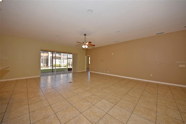 unfurnished room with ceiling fan and light tile patterned floors