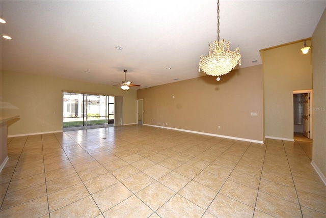 spare room with light tile patterned floors and ceiling fan with notable chandelier