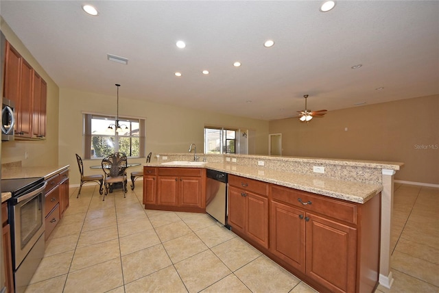 kitchen with ceiling fan, appliances with stainless steel finishes, light tile patterned flooring, and hanging light fixtures