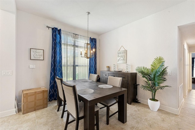 dining space featuring light tile patterned flooring