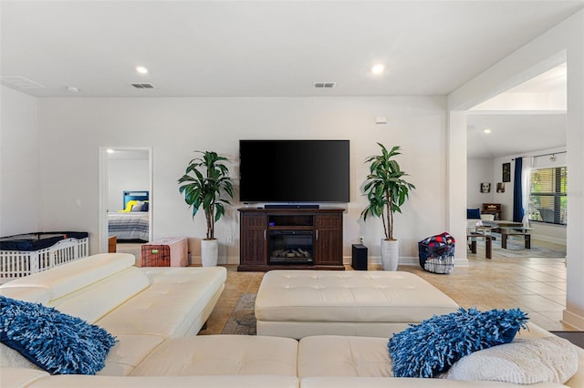 living room with light tile patterned floors