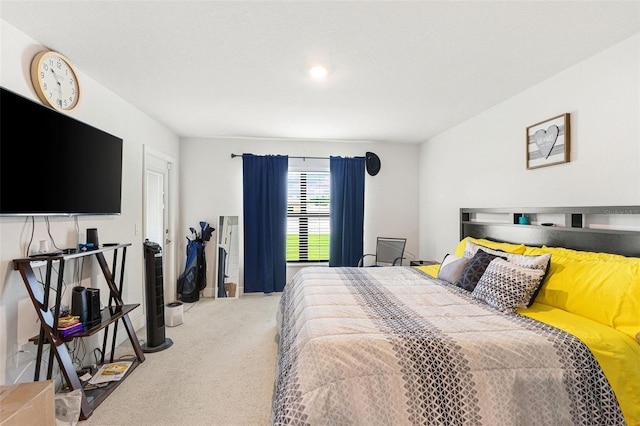 bedroom with light colored carpet