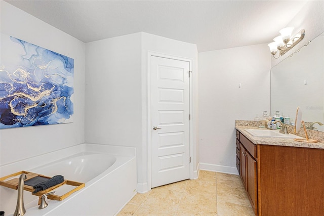 bathroom featuring vanity and a bath