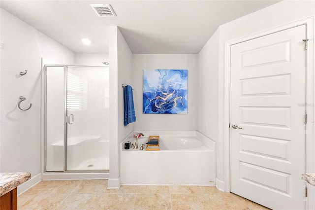 bathroom featuring vanity and separate shower and tub