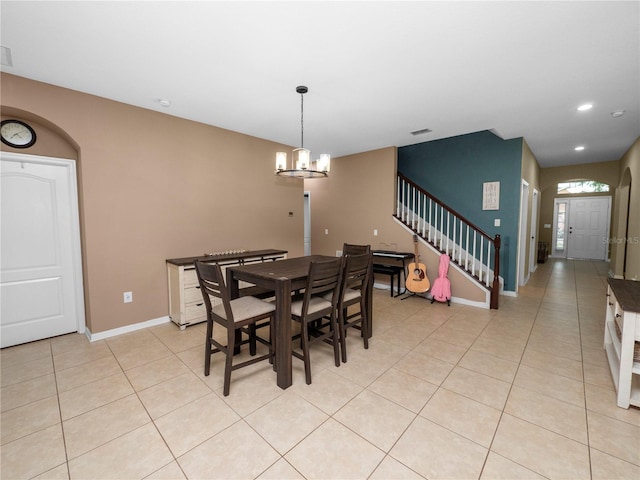 dining area with an inviting chandelier, recessed lighting, stairs, and light tile patterned flooring