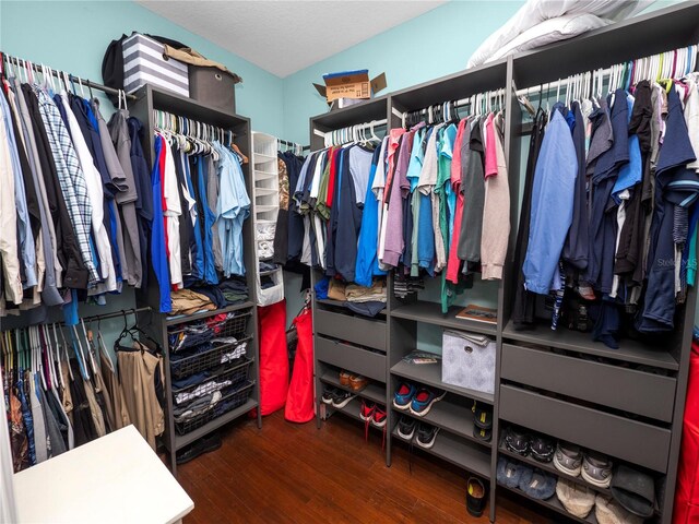 spacious closet with wood finished floors