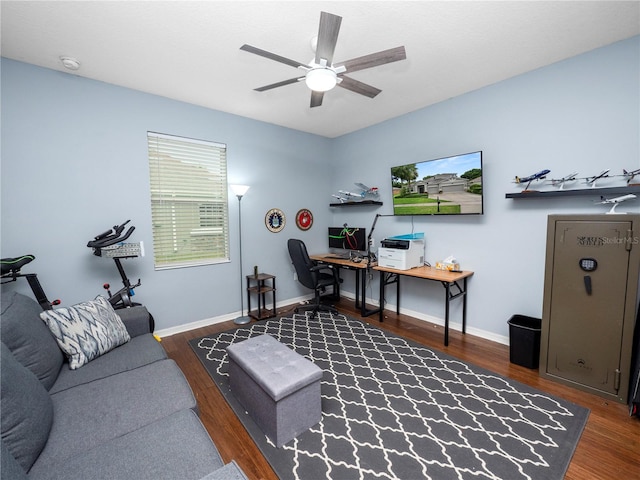 office space with ceiling fan, wood finished floors, and baseboards