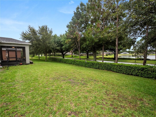 view of yard featuring a sunroom