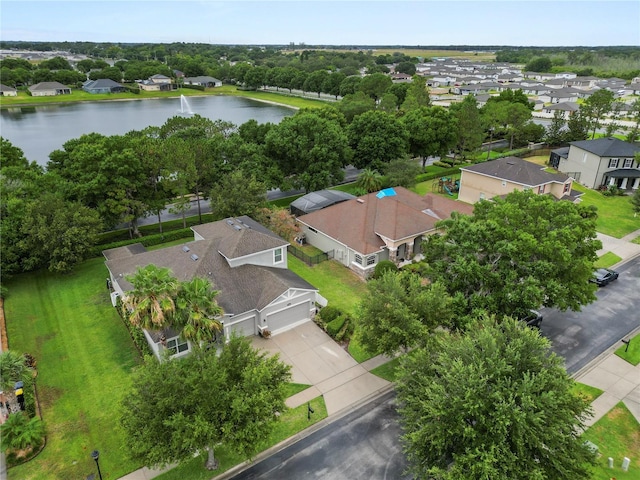 drone / aerial view with a water view and a residential view