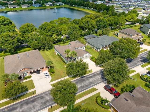 bird's eye view featuring a water view and a residential view