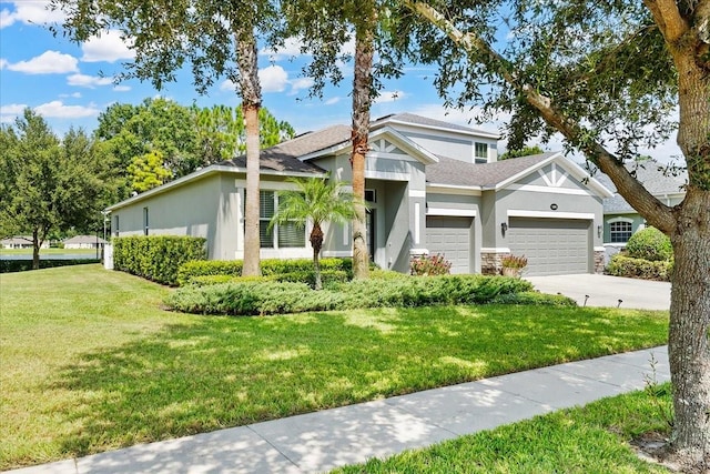 view of front of house with a garage and a front lawn