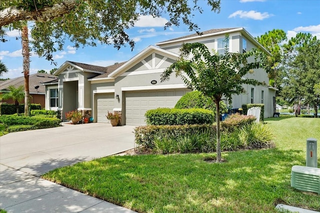 view of front of property with a garage and a front lawn