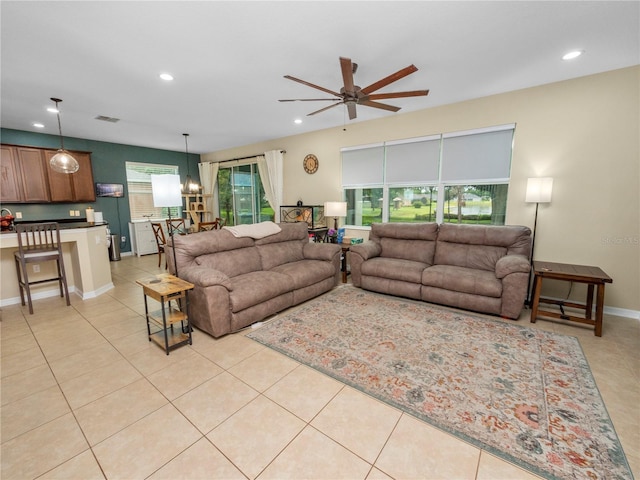 living room featuring a ceiling fan, recessed lighting, light tile patterned flooring, and visible vents