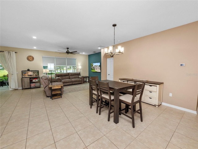 dining area featuring light tile patterned floors, ceiling fan with notable chandelier, recessed lighting, and baseboards