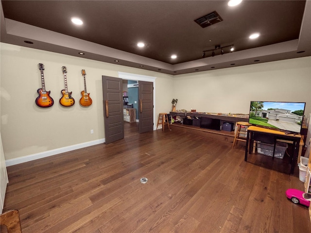 game room with baseboards, visible vents, a raised ceiling, wood finished floors, and recessed lighting