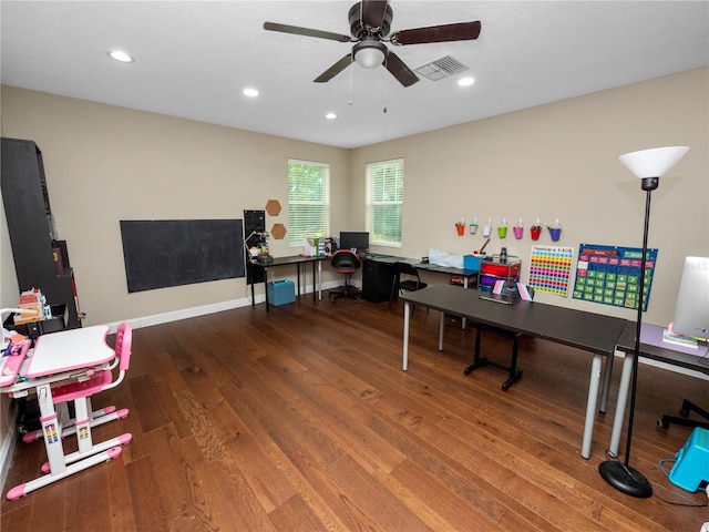 office space featuring baseboards, visible vents, ceiling fan, wood finished floors, and recessed lighting