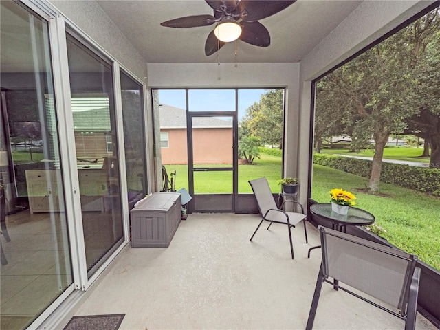 sunroom featuring ceiling fan