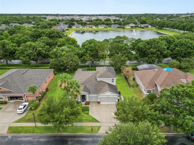 birds eye view of property with a water view and a residential view