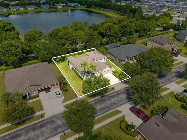 aerial view with a water view and a residential view