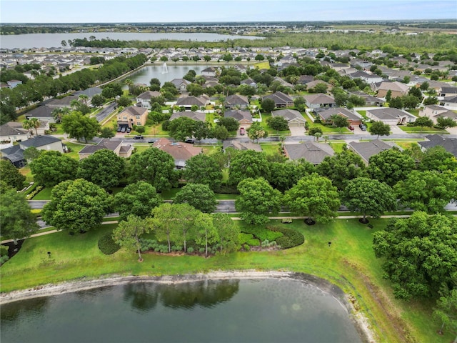 bird's eye view featuring a residential view and a water view