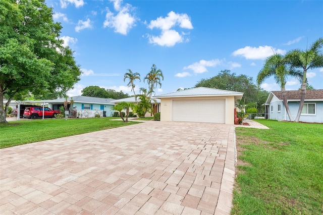 view of front of house featuring a front yard and a garage