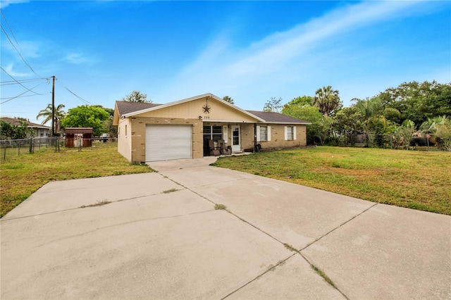 ranch-style home featuring a front lawn and a garage