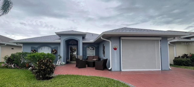 exterior space featuring a lawn and a patio