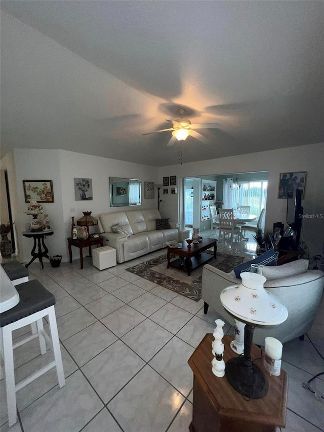 tiled living room with ceiling fan