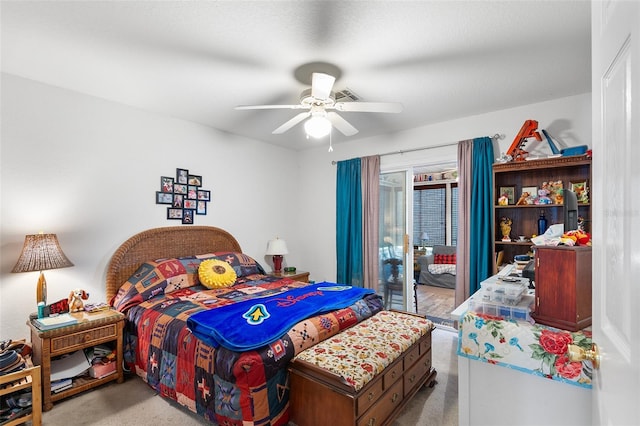 bedroom with access to outside, light colored carpet, and ceiling fan